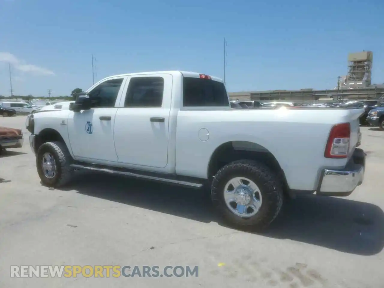 2 Photograph of a damaged car 3C6UR5CL3PG636676 RAM 2500 2023
