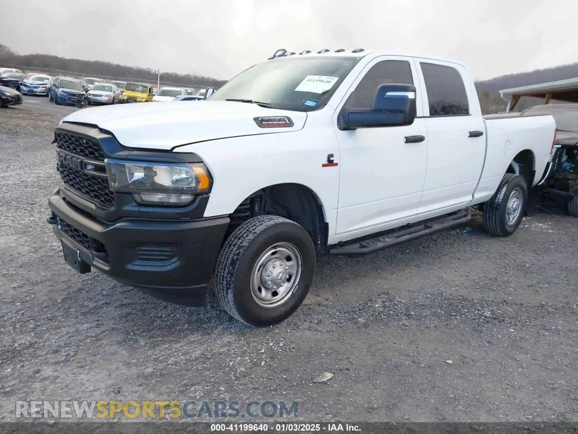 2 Photograph of a damaged car 3C6UR5CL5PG517155 RAM 2500 2023