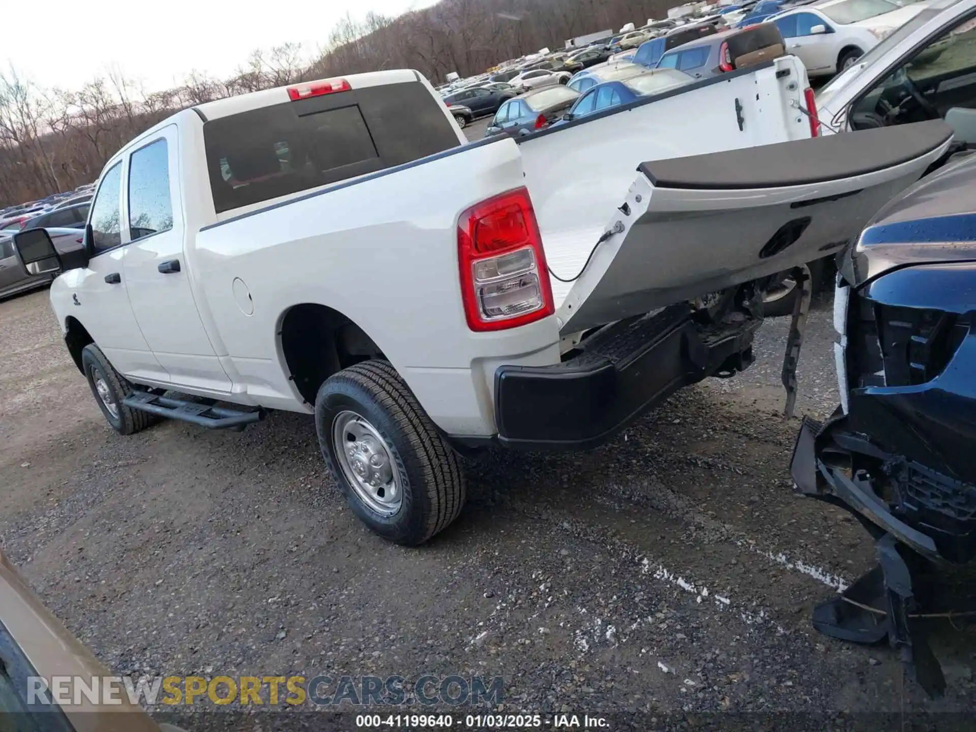 3 Photograph of a damaged car 3C6UR5CL5PG517155 RAM 2500 2023