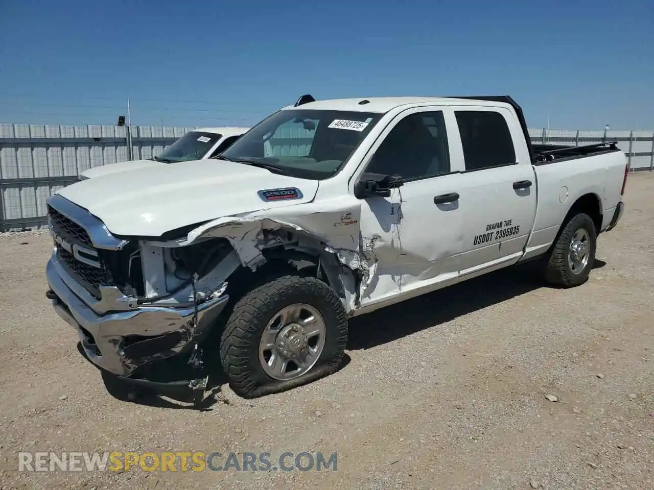 1 Photograph of a damaged car 3C6UR5CL7PG538704 RAM 2500 2023