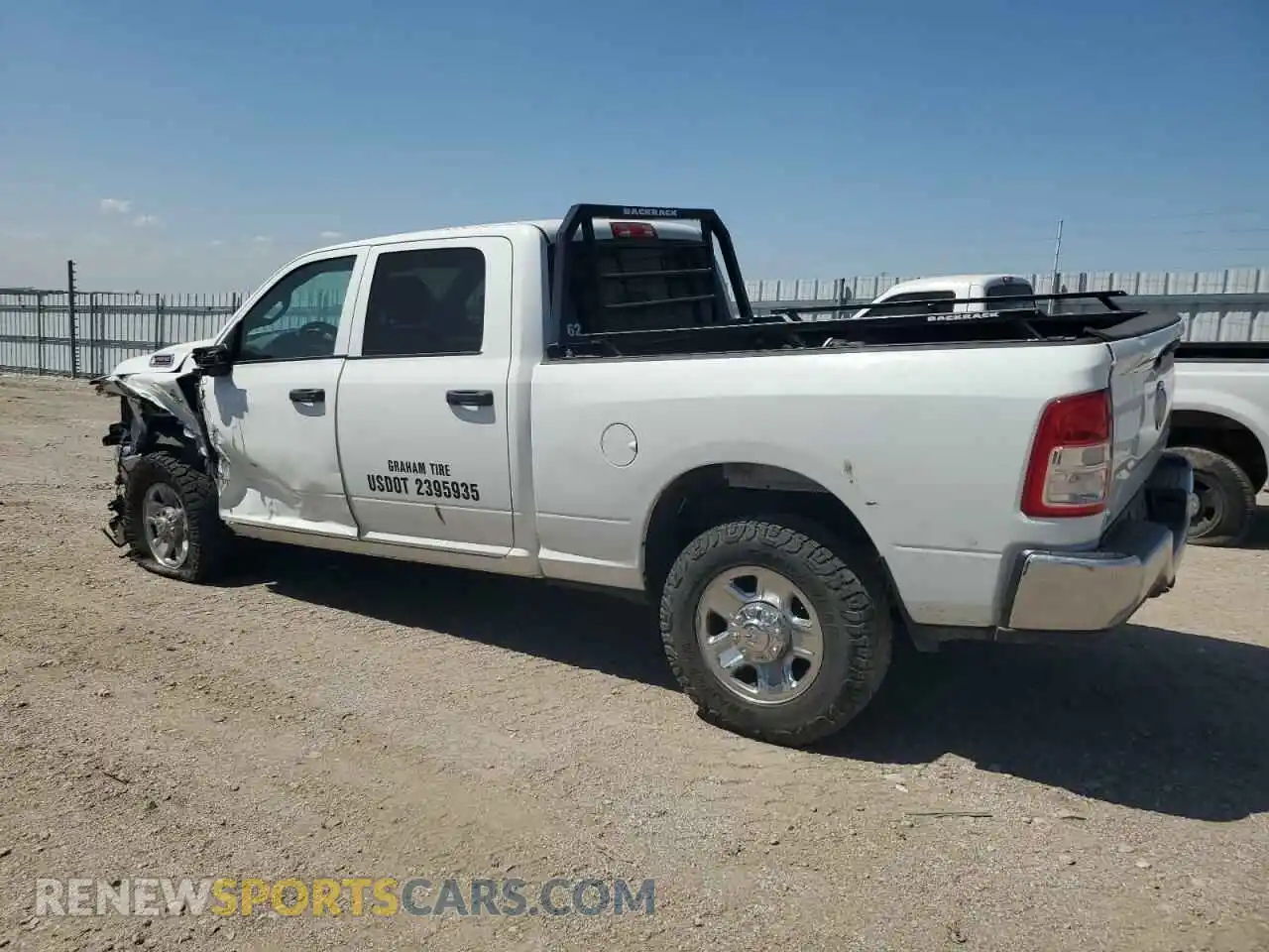 2 Photograph of a damaged car 3C6UR5CL7PG538704 RAM 2500 2023