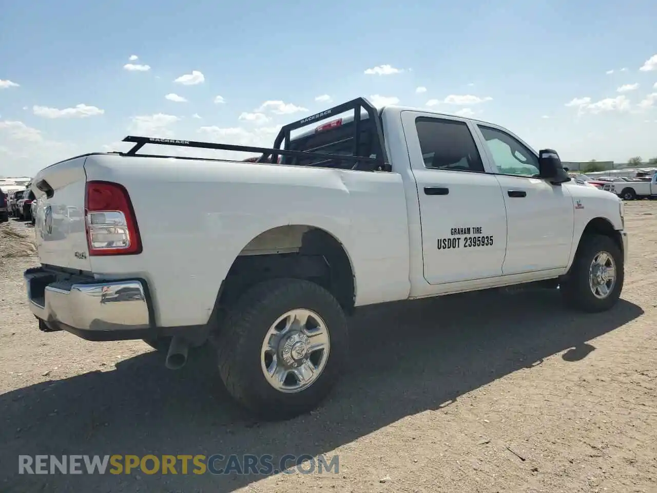 3 Photograph of a damaged car 3C6UR5CL7PG538704 RAM 2500 2023