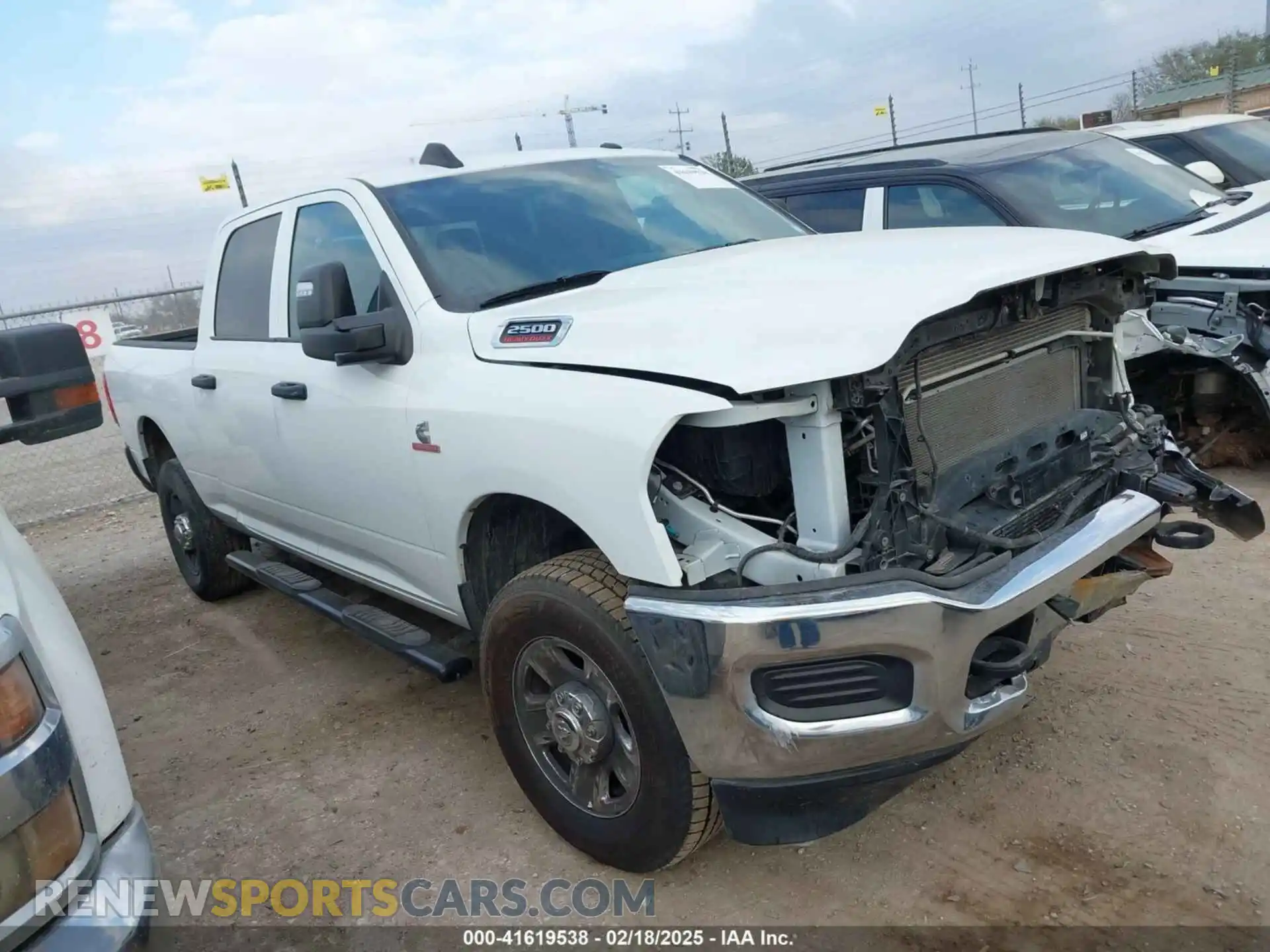 1 Photograph of a damaged car 3C6UR5CL7PG566941 RAM 2500 2023