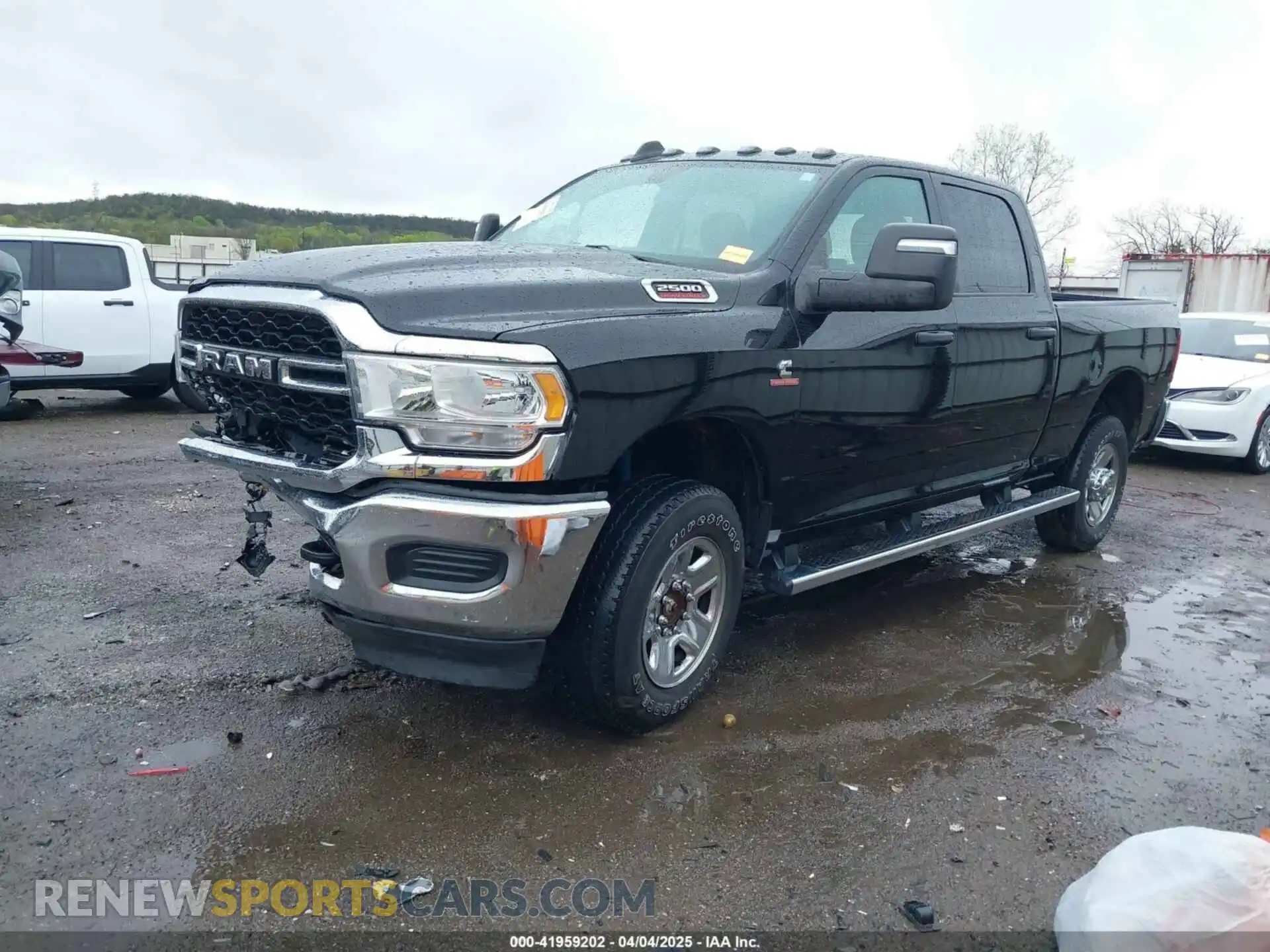 2 Photograph of a damaged car 3C6UR5CL9PG593221 RAM 2500 2023