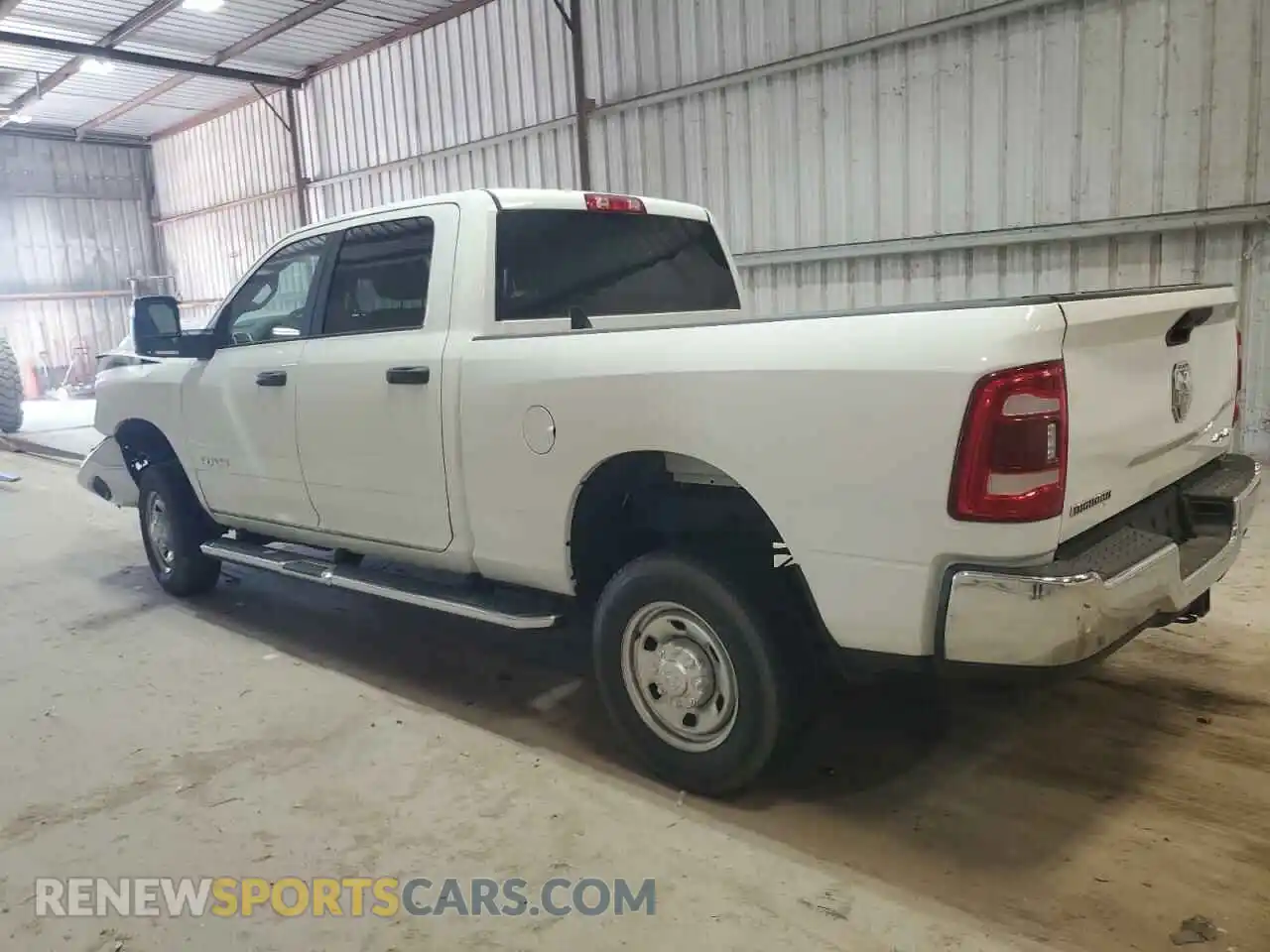 2 Photograph of a damaged car 3C6UR5DJ1PG542986 RAM 2500 2023