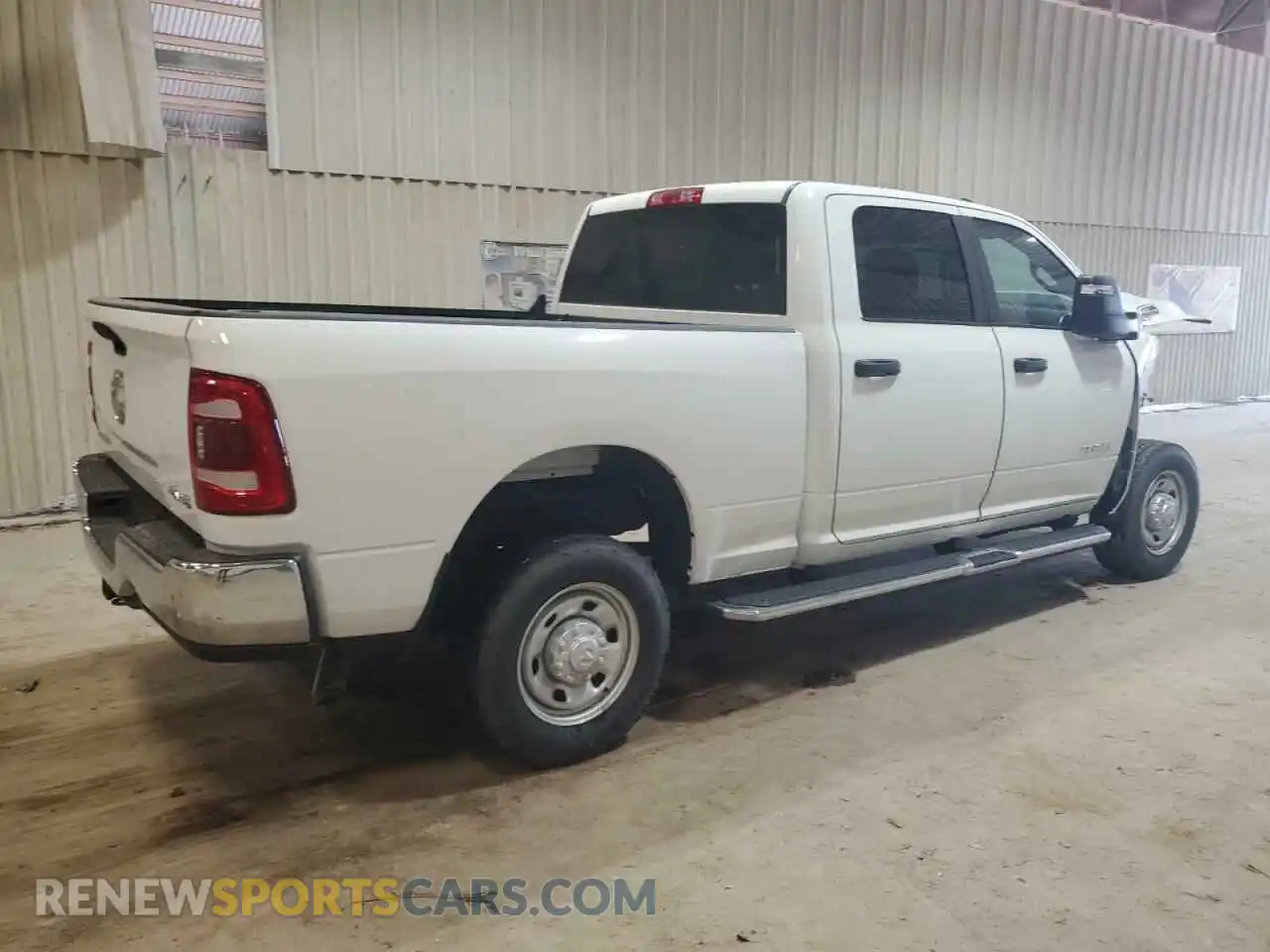 3 Photograph of a damaged car 3C6UR5DJ1PG542986 RAM 2500 2023