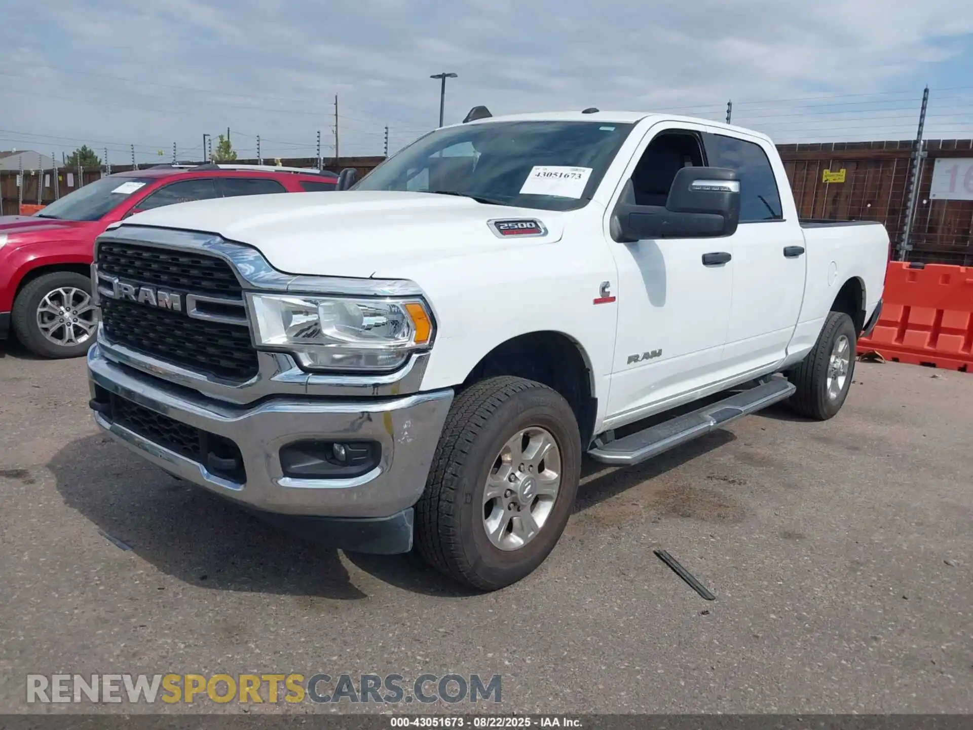 2 Photograph of a damaged car 3C6UR5DL2PG576310 RAM 2500 2023