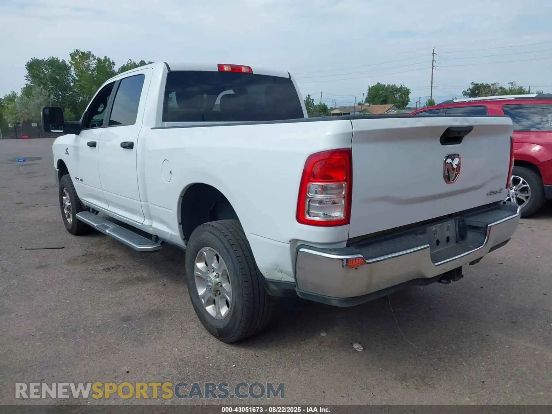 3 Photograph of a damaged car 3C6UR5DL2PG576310 RAM 2500 2023