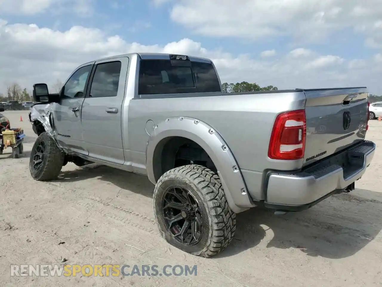 2 Photograph of a damaged car 3C6UR5DL2PG592457 RAM 2500 2023
