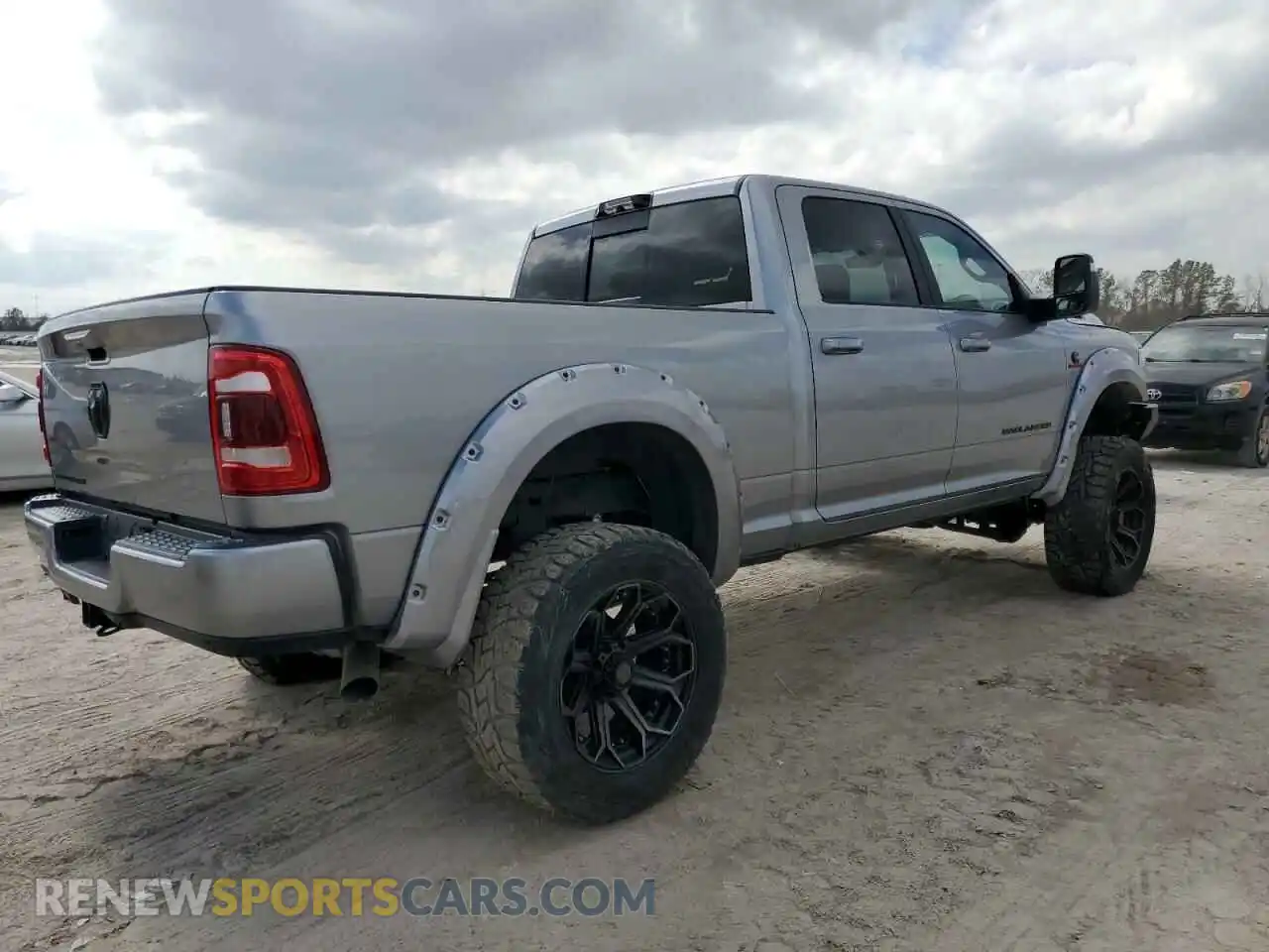 3 Photograph of a damaged car 3C6UR5DL2PG592457 RAM 2500 2023
