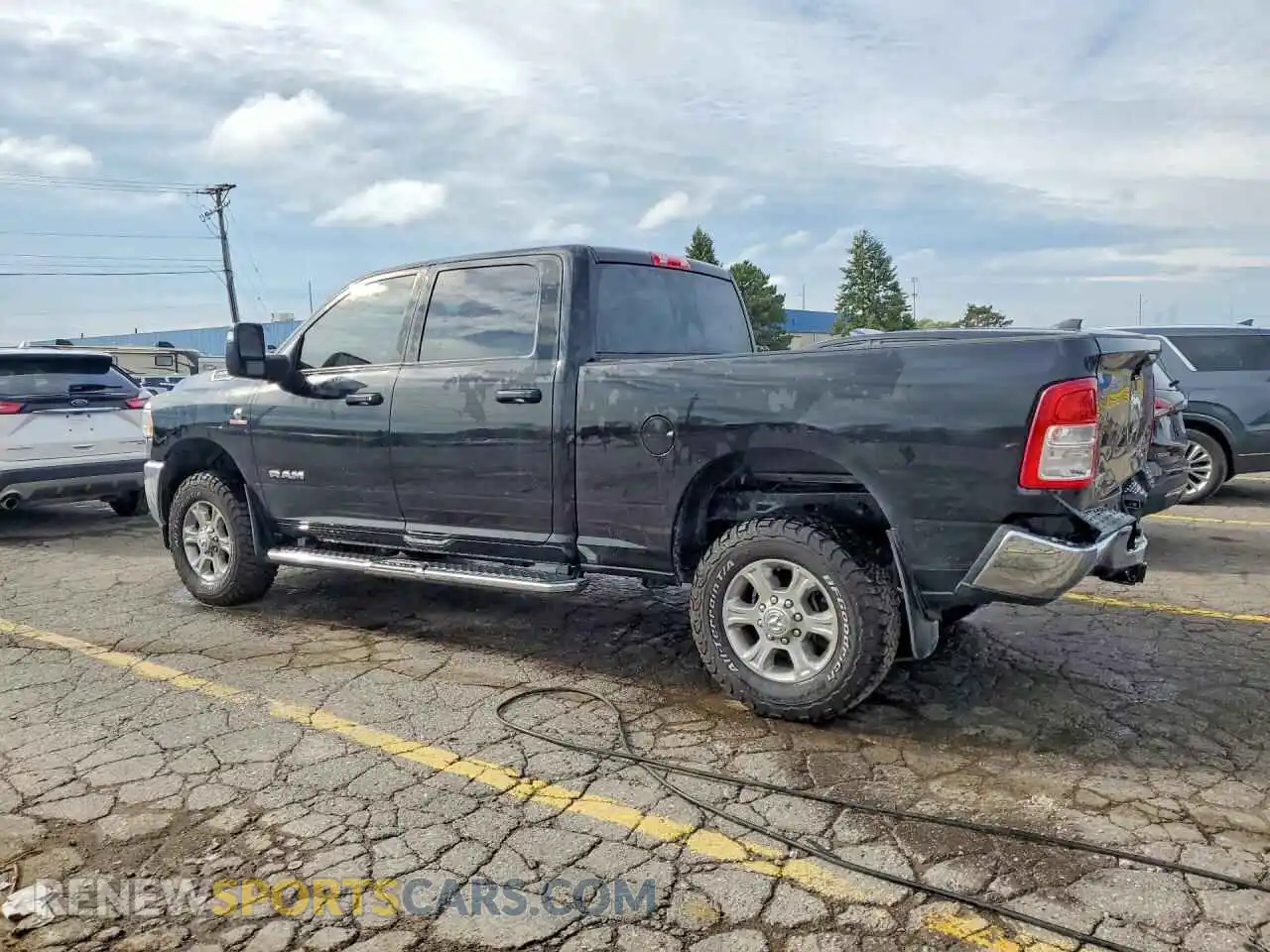 2 Photograph of a damaged car 3C6UR5DL4PG651217 RAM 2500 2023