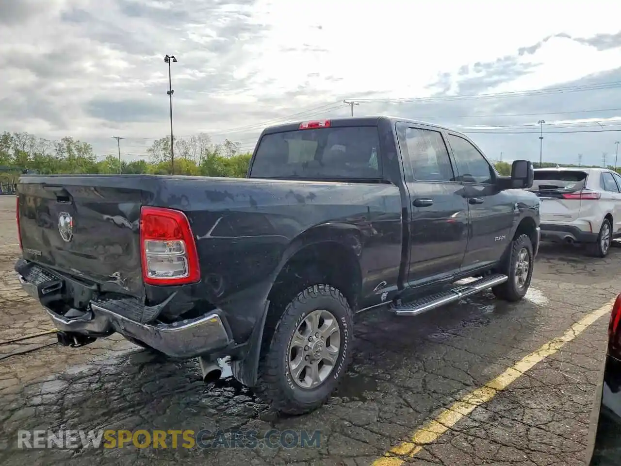 3 Photograph of a damaged car 3C6UR5DL4PG651217 RAM 2500 2023
