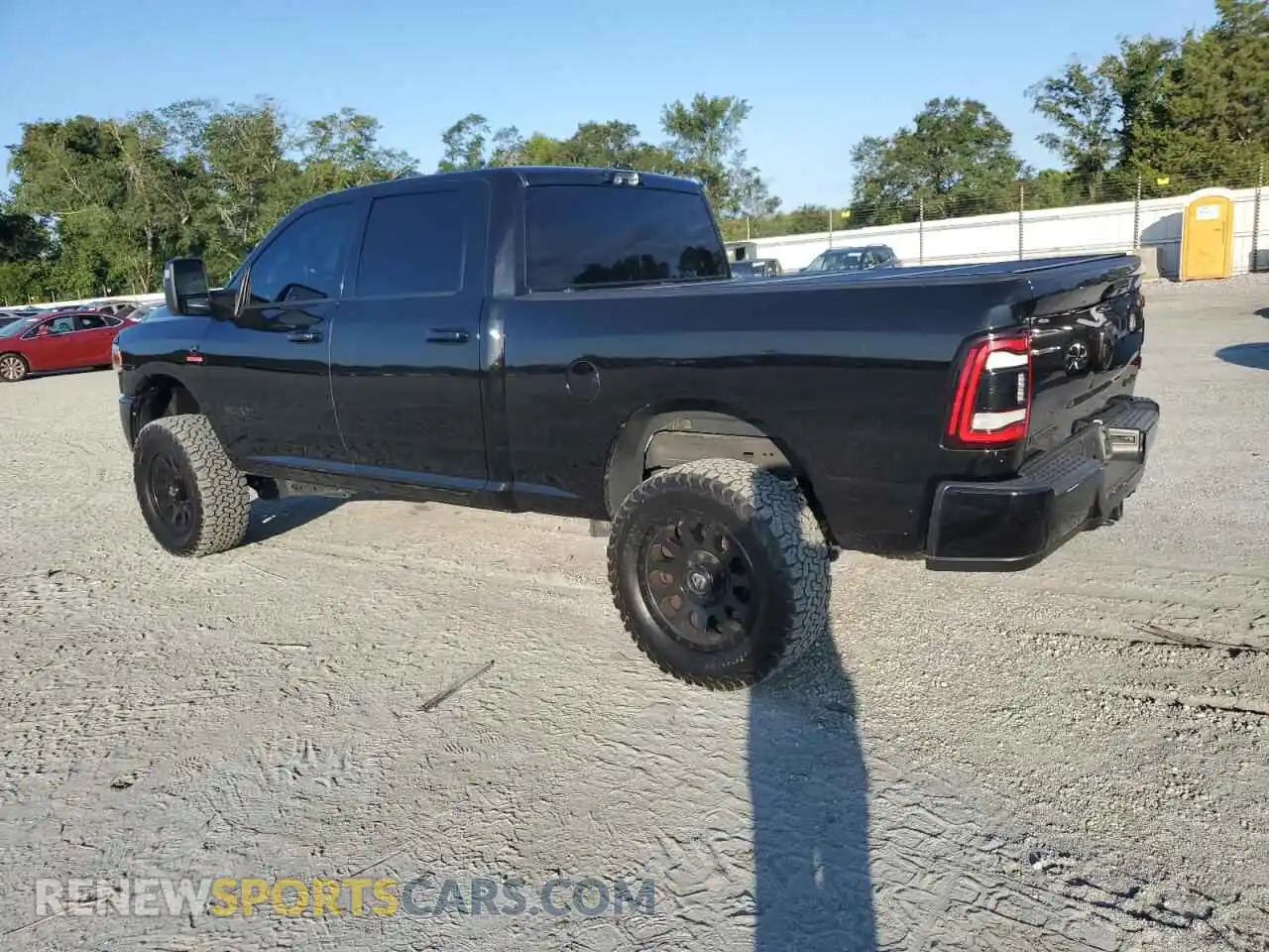 2 Photograph of a damaged car 3C6UR5DL5PG650240 RAM 2500 2023