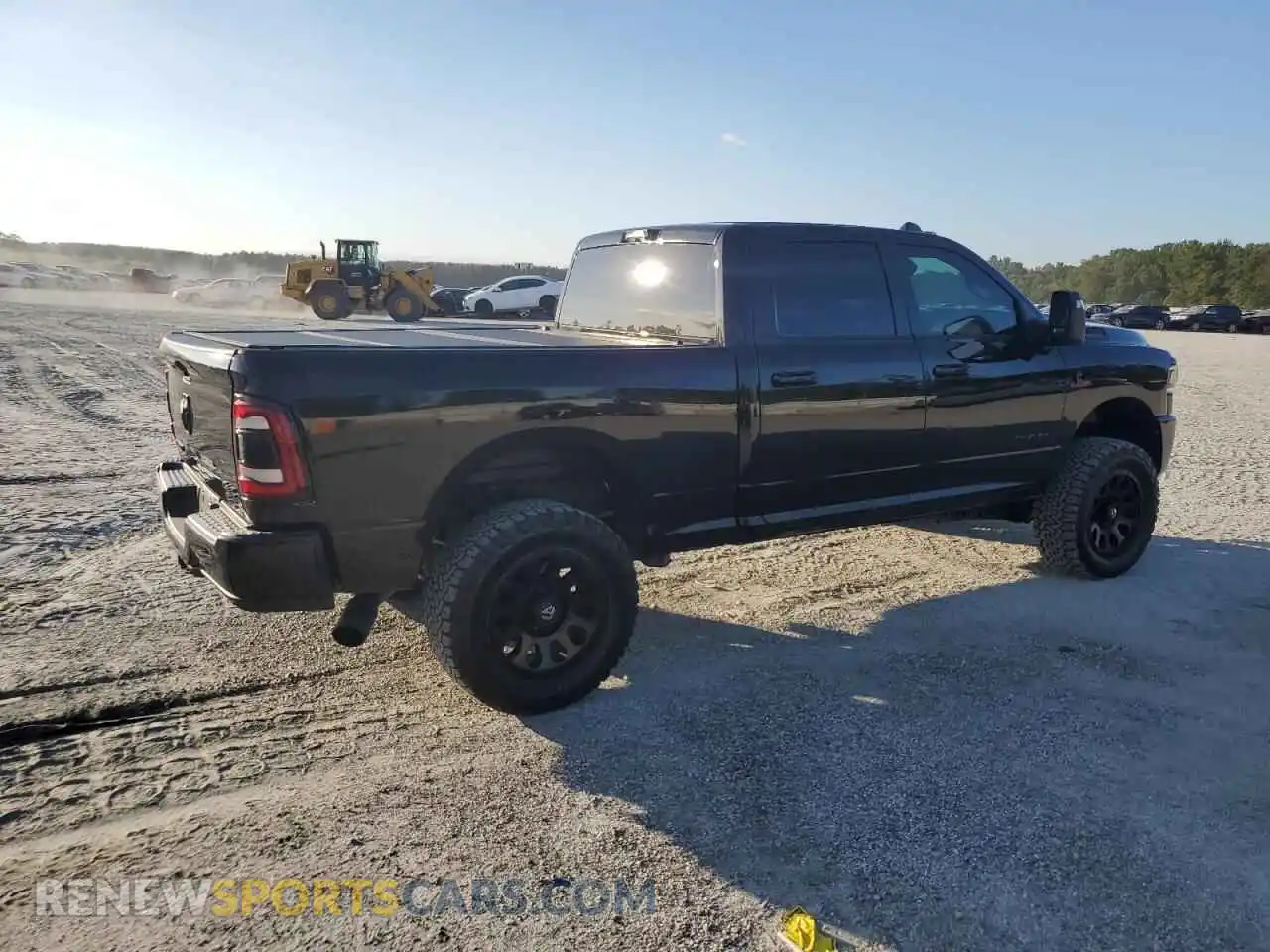 3 Photograph of a damaged car 3C6UR5DL5PG650240 RAM 2500 2023