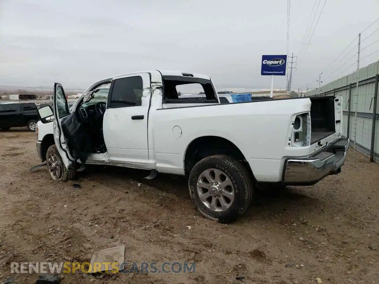 2 Photograph of a damaged car 3C6UR5DL7PG518595 RAM 2500 2023