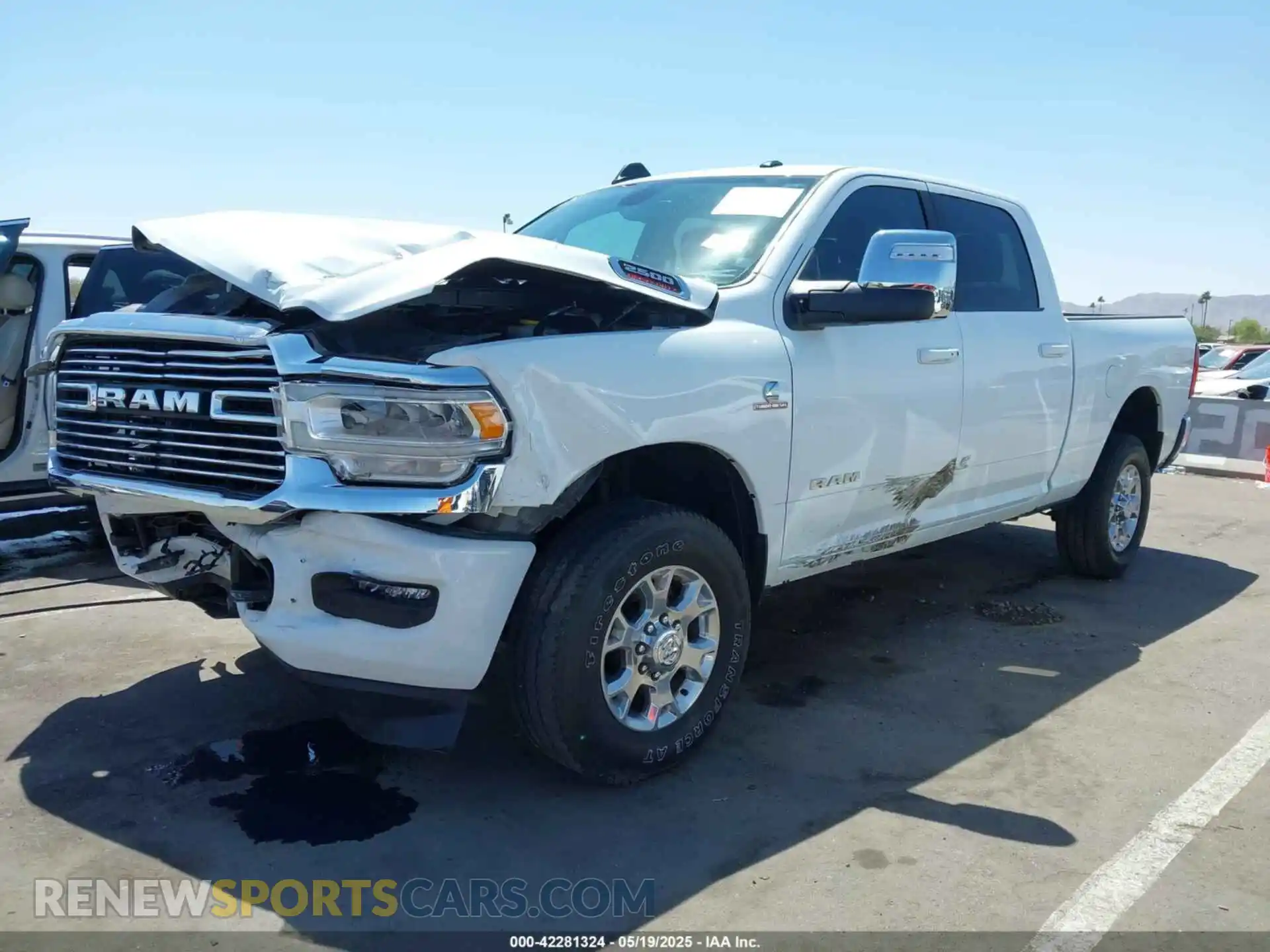 2 Photograph of a damaged car 3C6UR5FL2PG559276 RAM 2500 2023