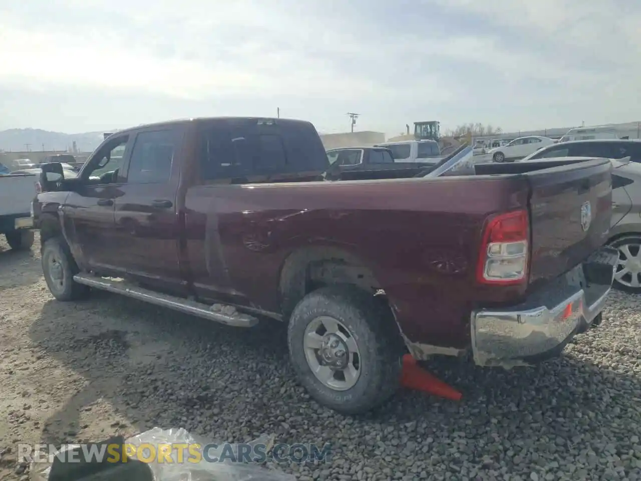 2 Photograph of a damaged car 3C6UR5HL2PG540031 RAM 2500 2023