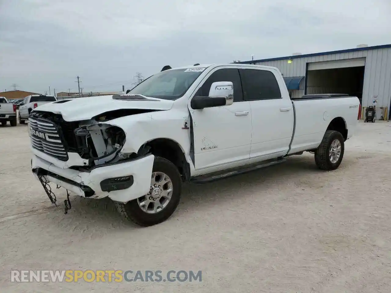 1 Photograph of a damaged car 3C6UR5KL4PG549631 RAM 2500 2023