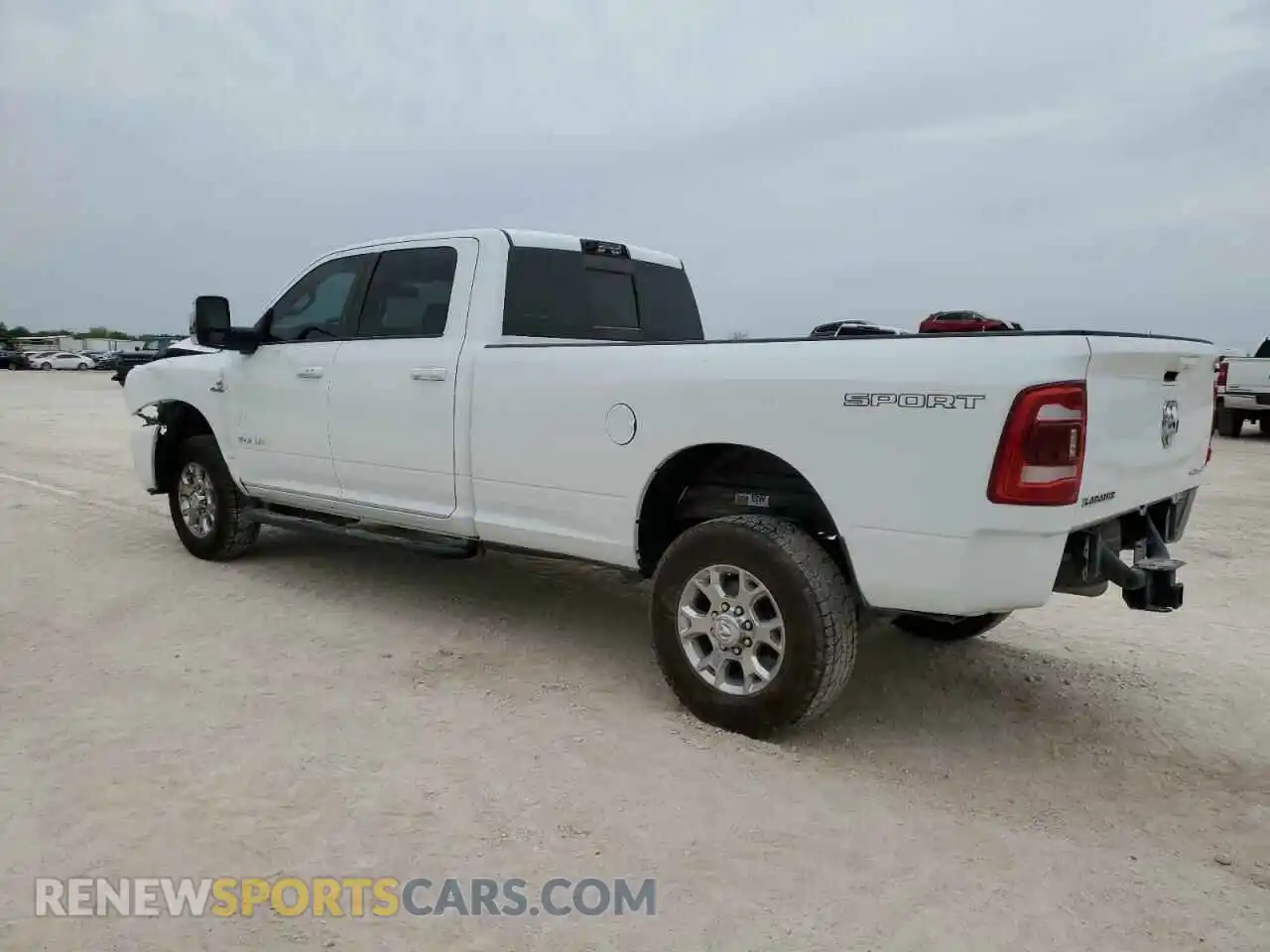 2 Photograph of a damaged car 3C6UR5KL4PG549631 RAM 2500 2023