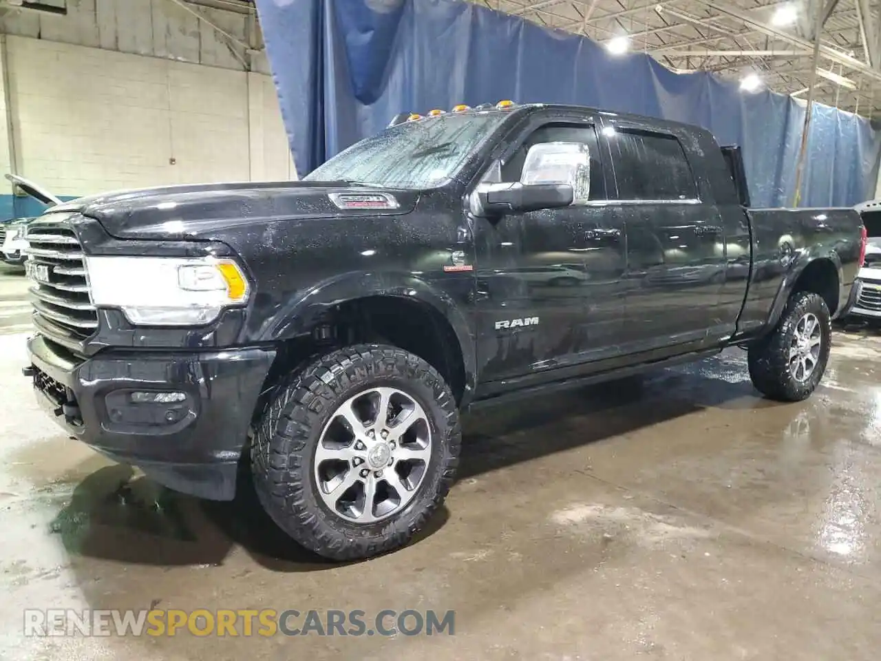 1 Photograph of a damaged car 3C6UR5PL8PG591647 RAM 2500 2023