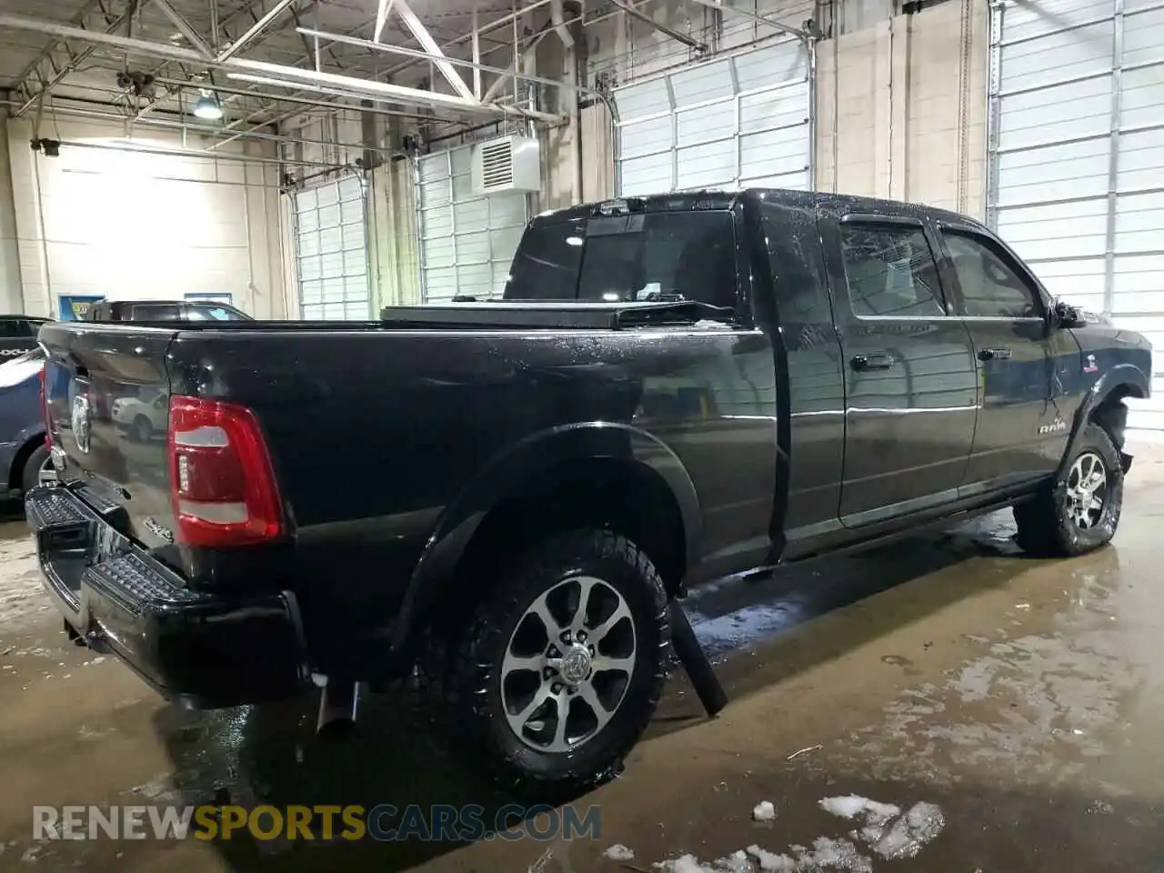 3 Photograph of a damaged car 3C6UR5PL8PG591647 RAM 2500 2023