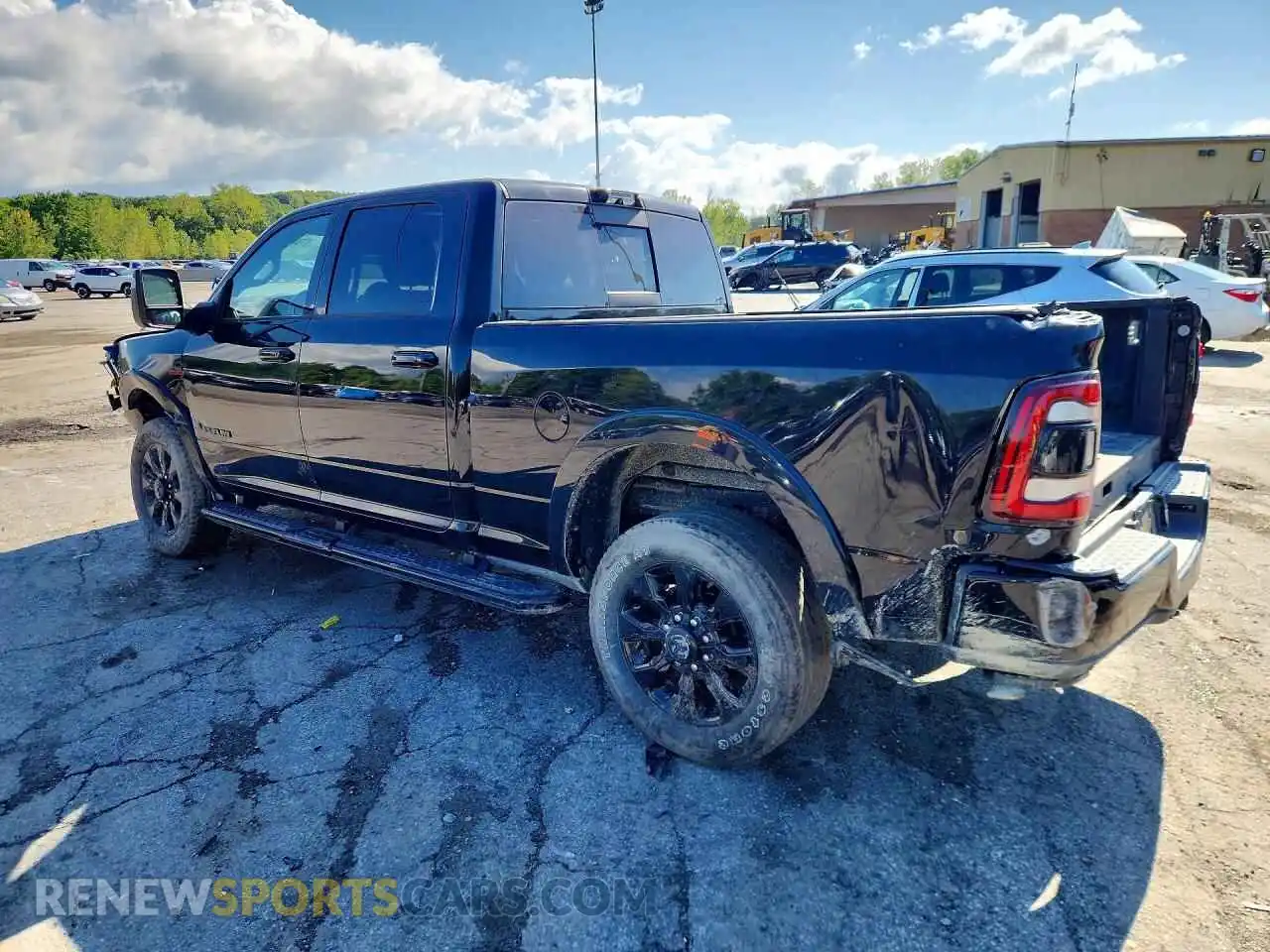 2 Photograph of a damaged car 3C6UR5SL6PG502780 RAM 2500 2023