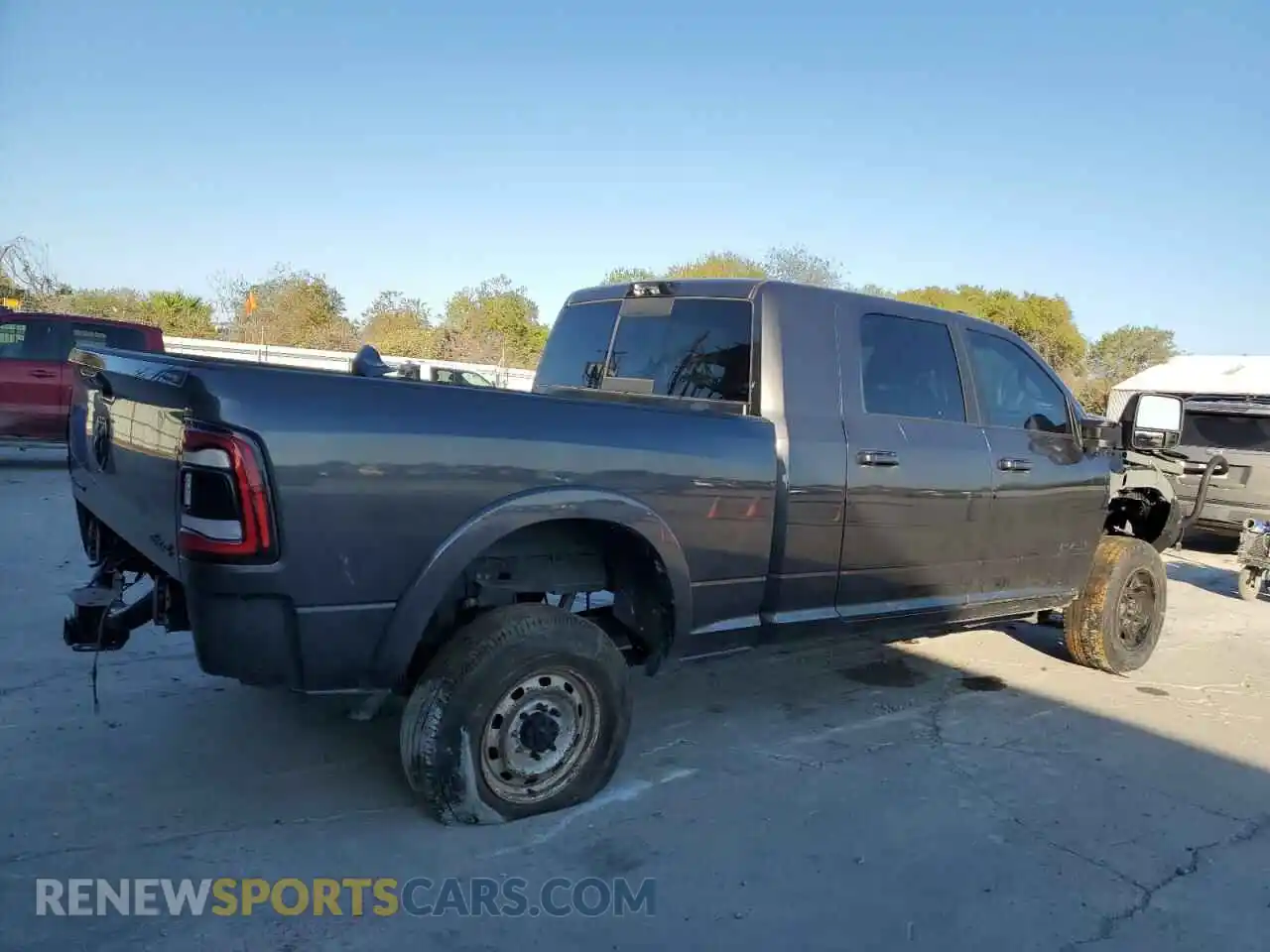 3 Photograph of a damaged car 3C6UR5TL9PG513898 RAM 2500 2023