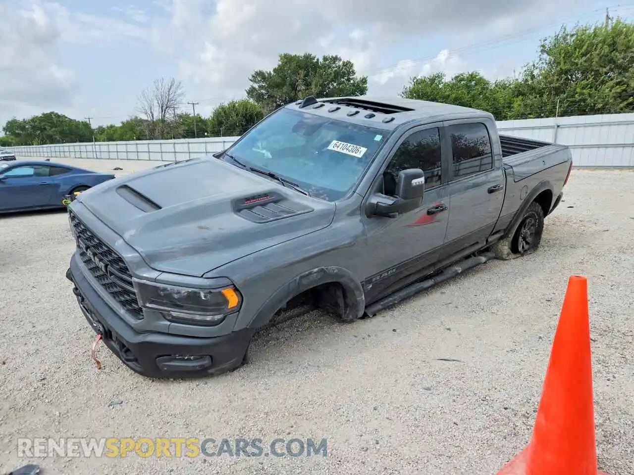 1 Photograph of a damaged car 3C6TR5EJ6RG369348 RAM 2500 2024