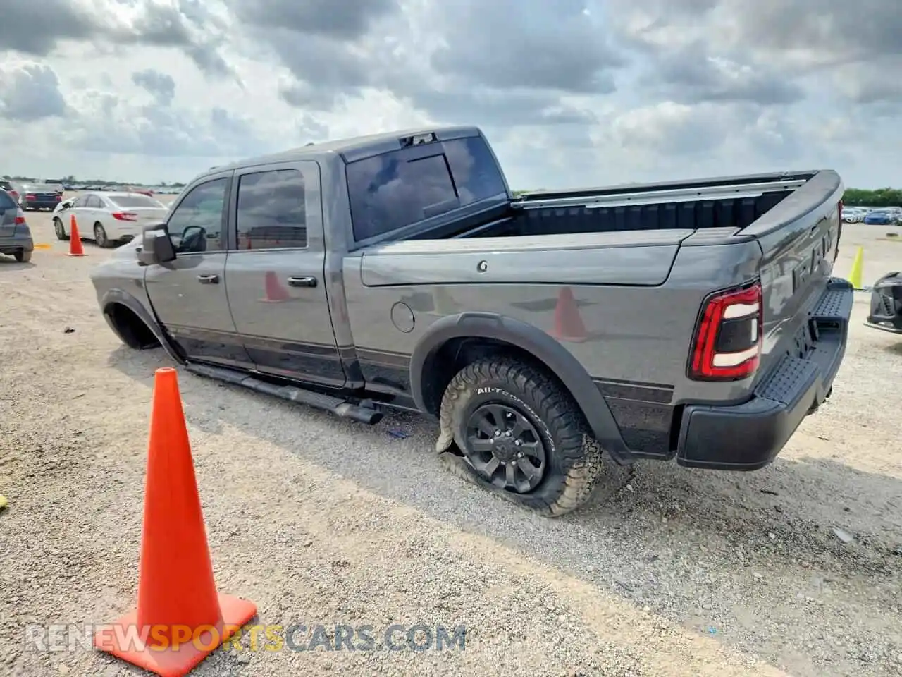 2 Photograph of a damaged car 3C6TR5EJ6RG369348 RAM 2500 2024
