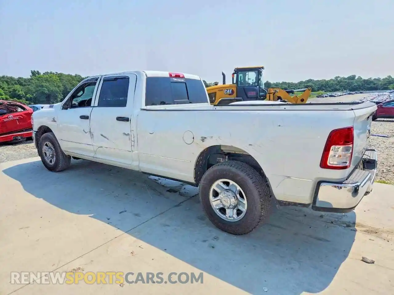 2 Photograph of a damaged car 3C6UR4HL7RG416348 RAM 2500 2024