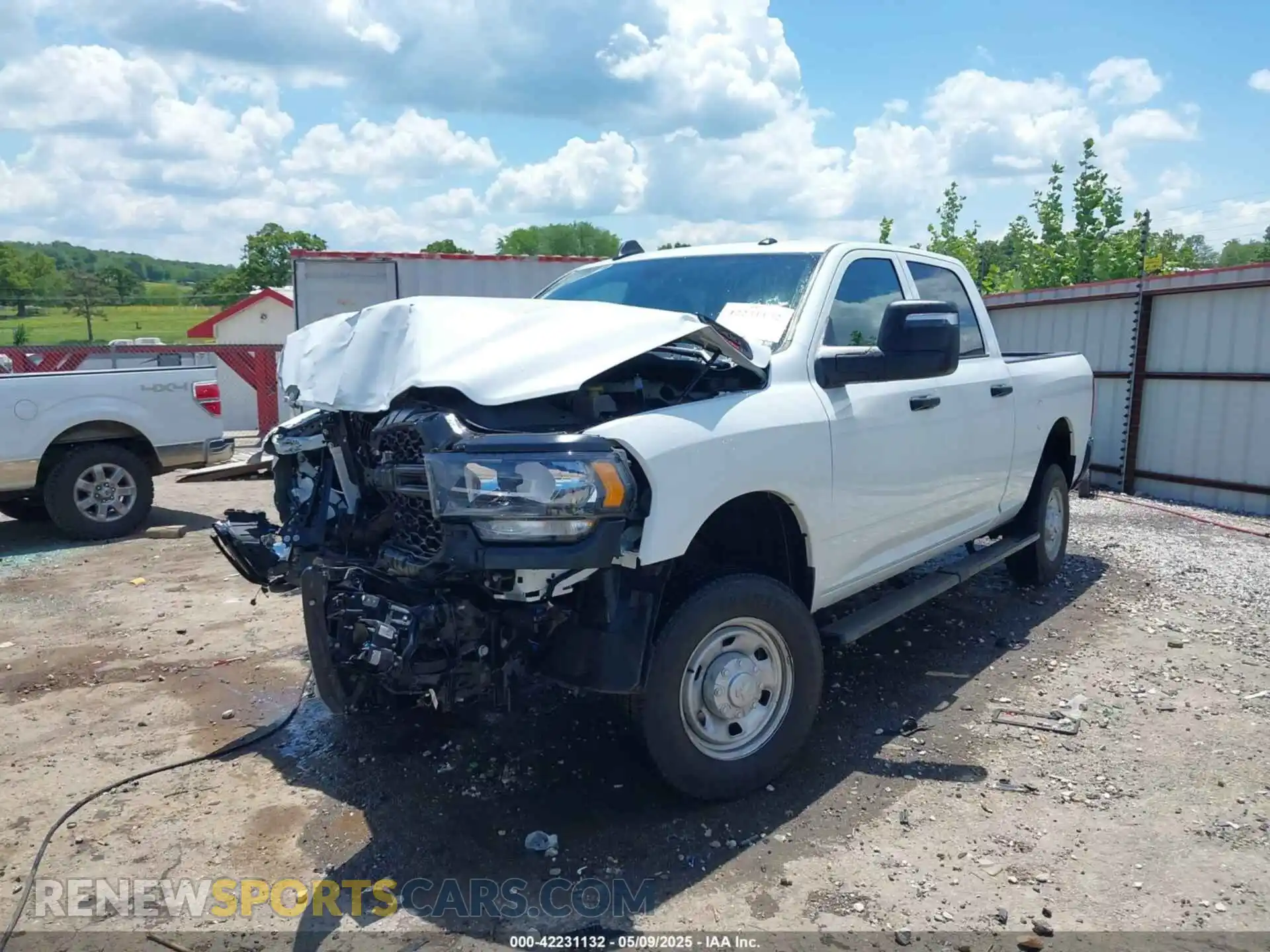 2 Photograph of a damaged car 3C6UR5CJ0RG131566 RAM 2500 2024
