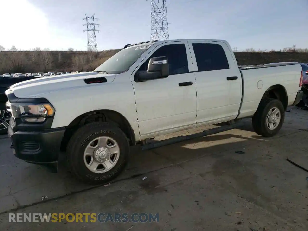 1 Photograph of a damaged car 3C6UR5CJ0RG143314 RAM 2500 2024