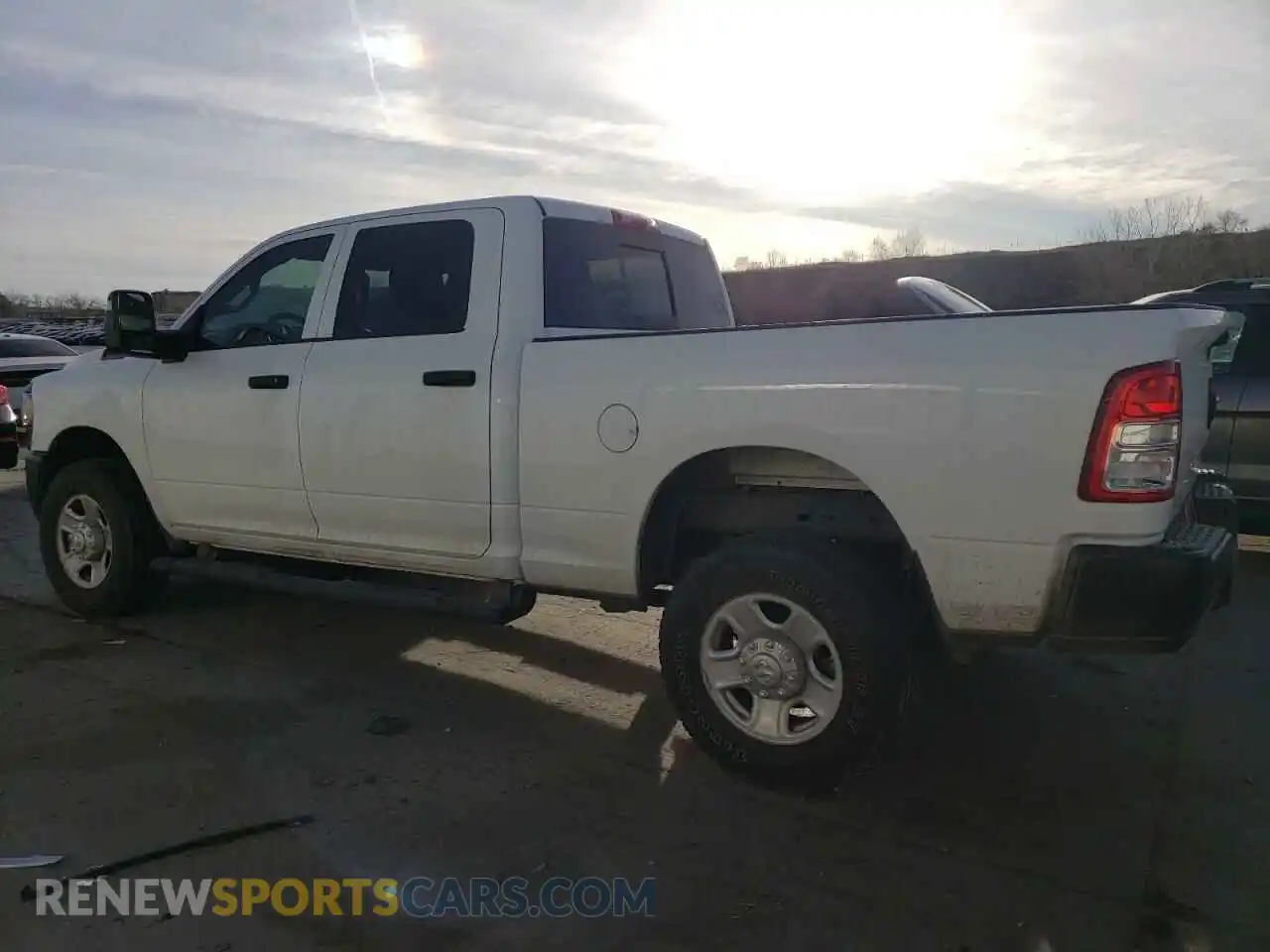2 Photograph of a damaged car 3C6UR5CJ0RG143314 RAM 2500 2024
