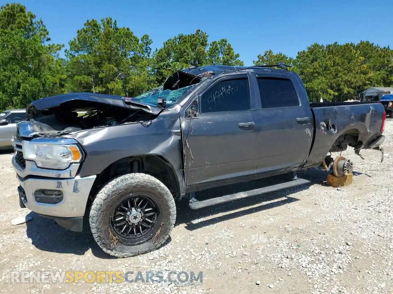 1 Photograph of a damaged car 3C6UR5CJ3RG181278 RAM 2500 2024