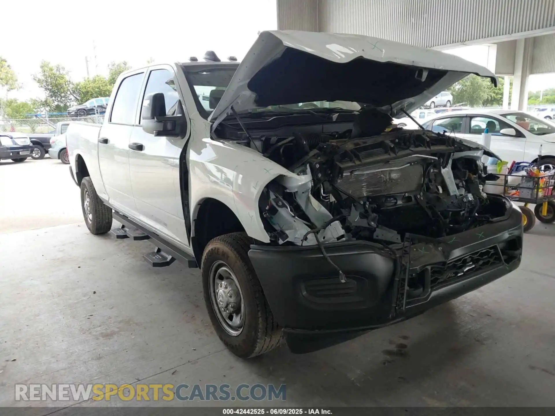 1 Photograph of a damaged car 3C6UR5CJ4RG267621 RAM 2500 2024