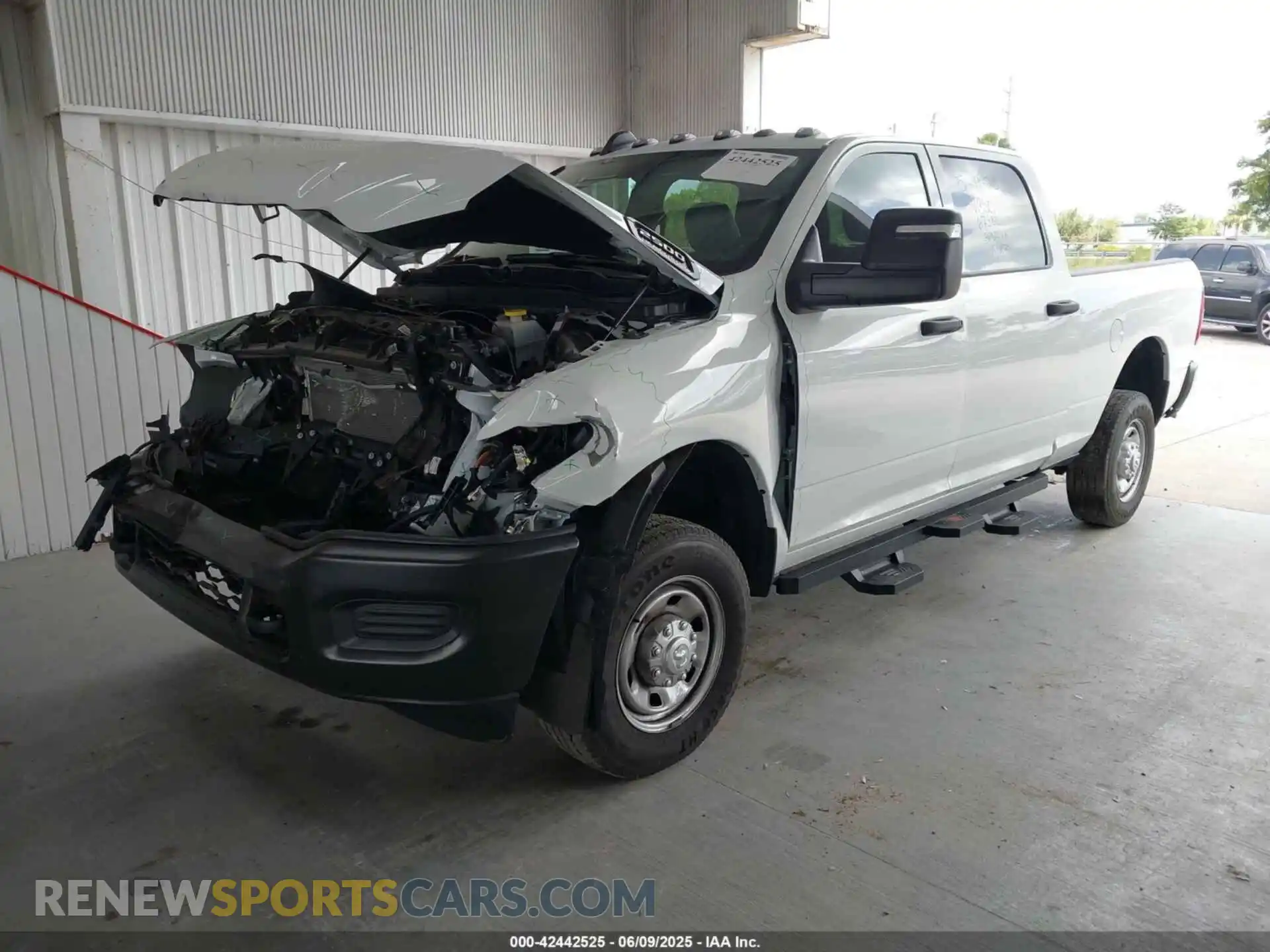 2 Photograph of a damaged car 3C6UR5CJ4RG267621 RAM 2500 2024