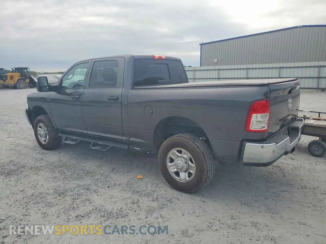 2 Photograph of a damaged car 3C6UR5CJ9RG314822 RAM 2500 2024