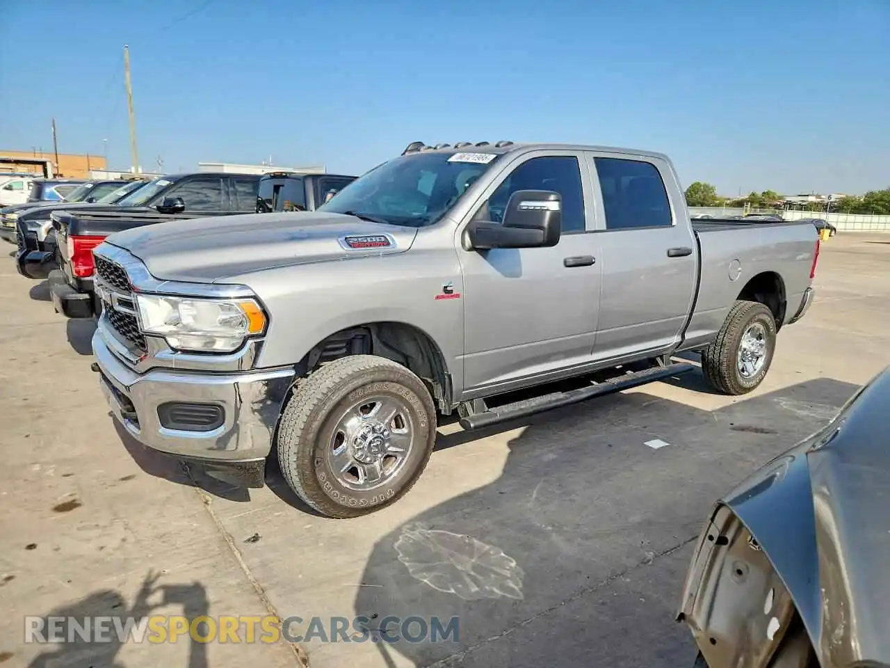 1 Photograph of a damaged car 3C6UR5CL1RG319630 RAM 2500 2024