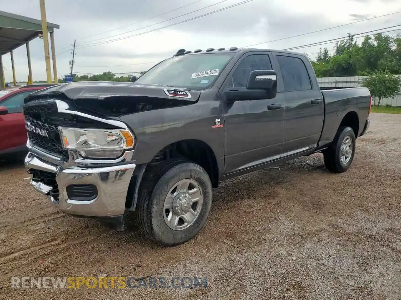 1 Photograph of a damaged car 3C6UR5CL2RG119422 RAM 2500 2024