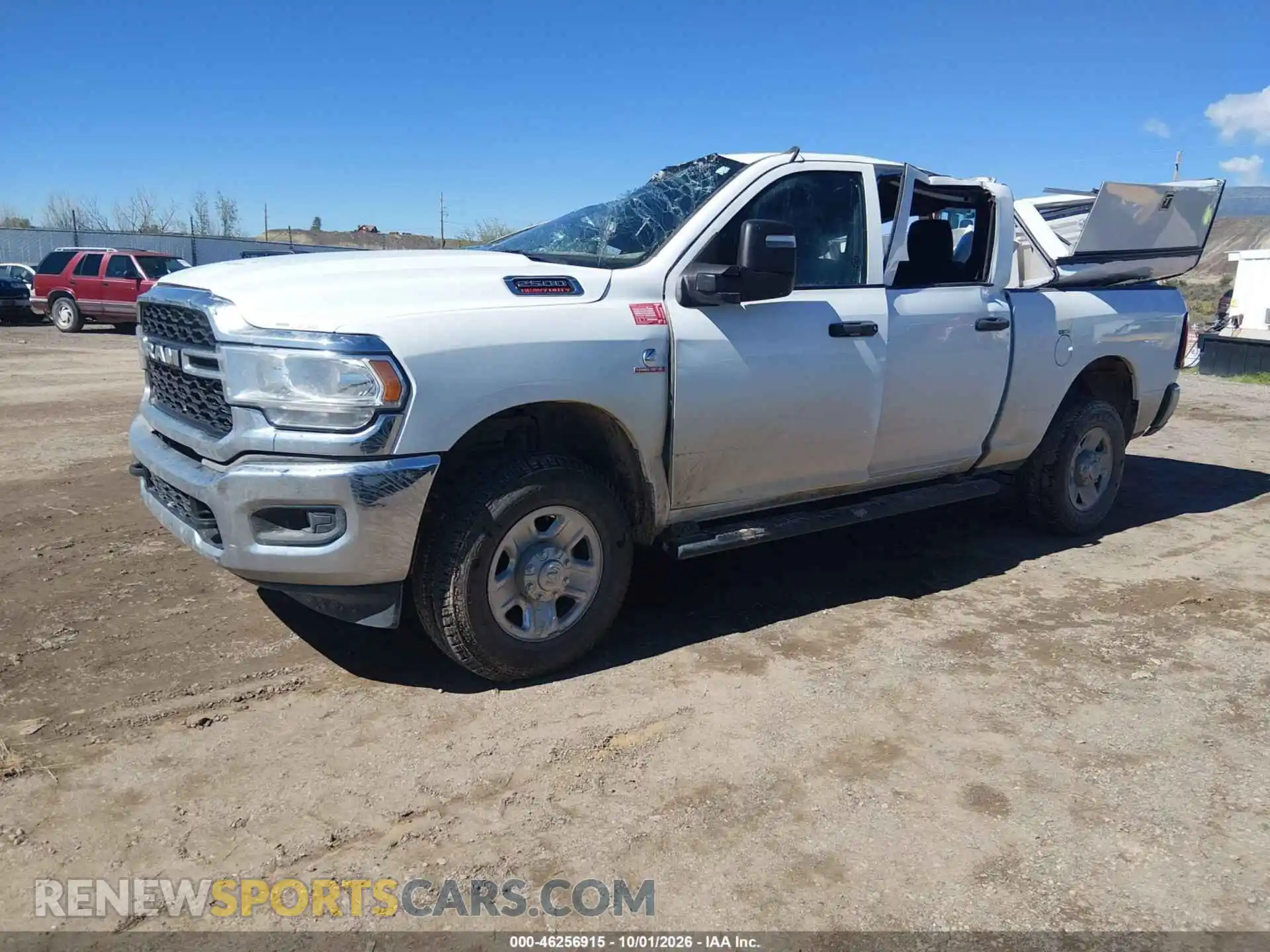 2 Photograph of a damaged car 3C6UR5CL4RG194655 RAM 2500 2024