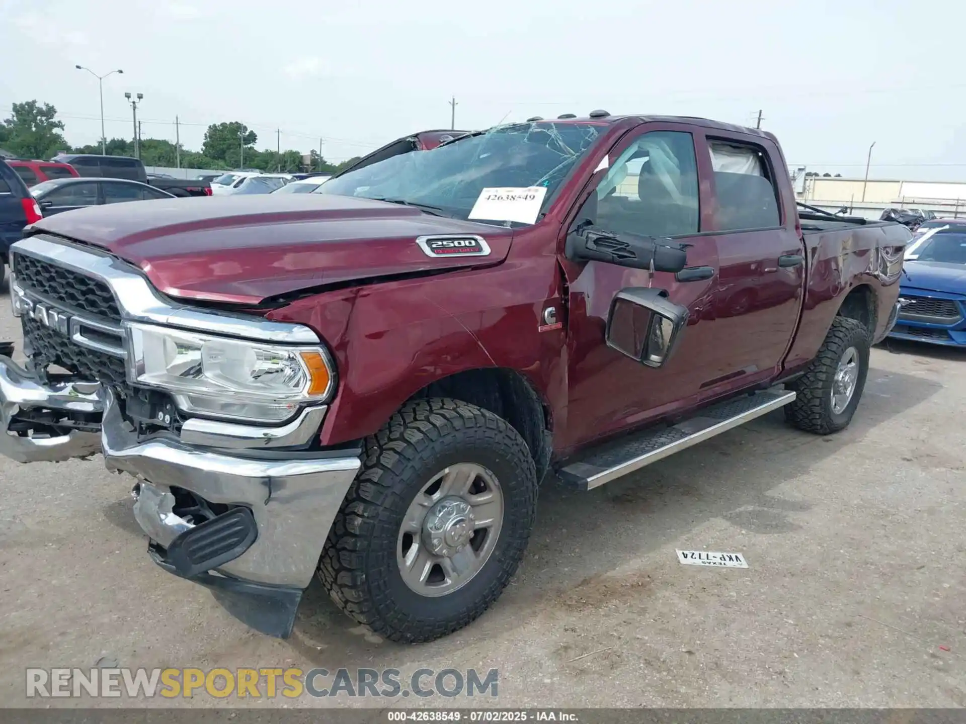 2 Photograph of a damaged car 3C6UR5CL5RG264826 RAM 2500 2024
