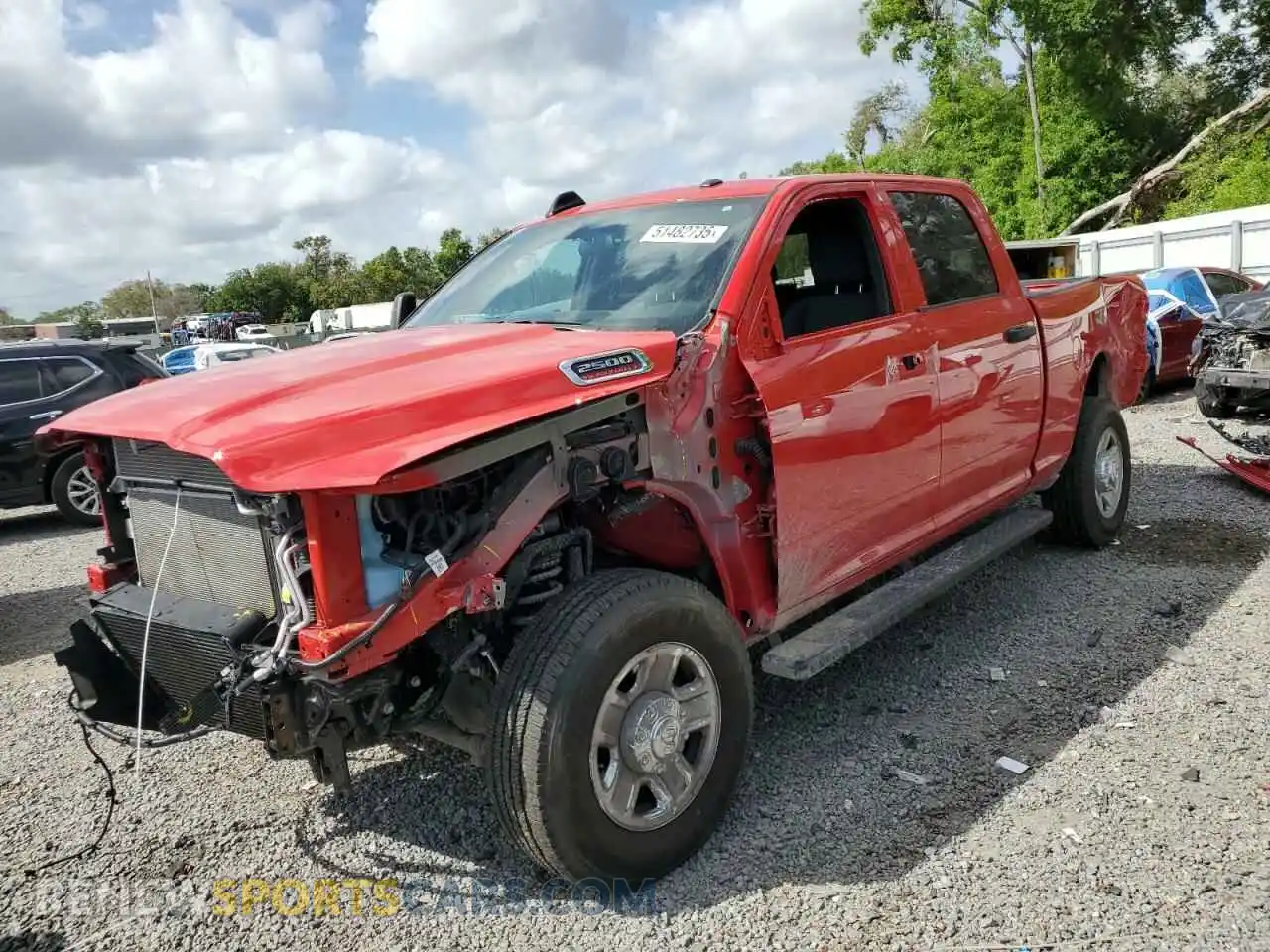 1 Photograph of a damaged car 3C6UR5CL6RG245542 RAM 2500 2024