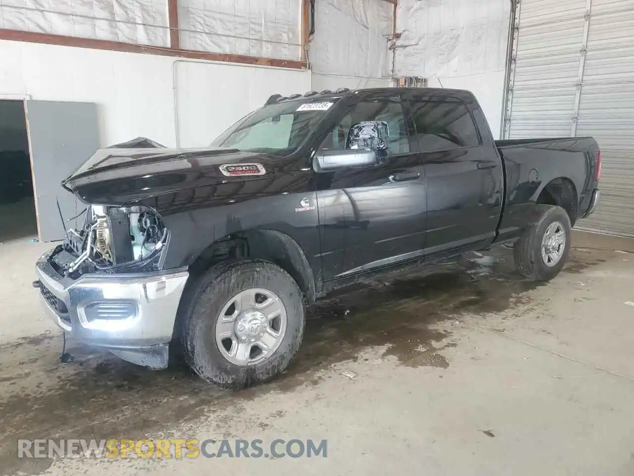1 Photograph of a damaged car 3C6UR5CL6RG309563 RAM 2500 2024