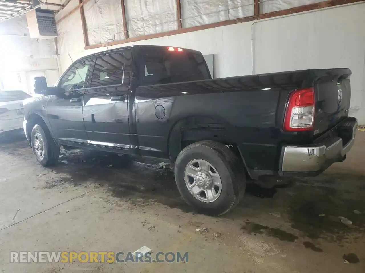 2 Photograph of a damaged car 3C6UR5CL6RG309563 RAM 2500 2024