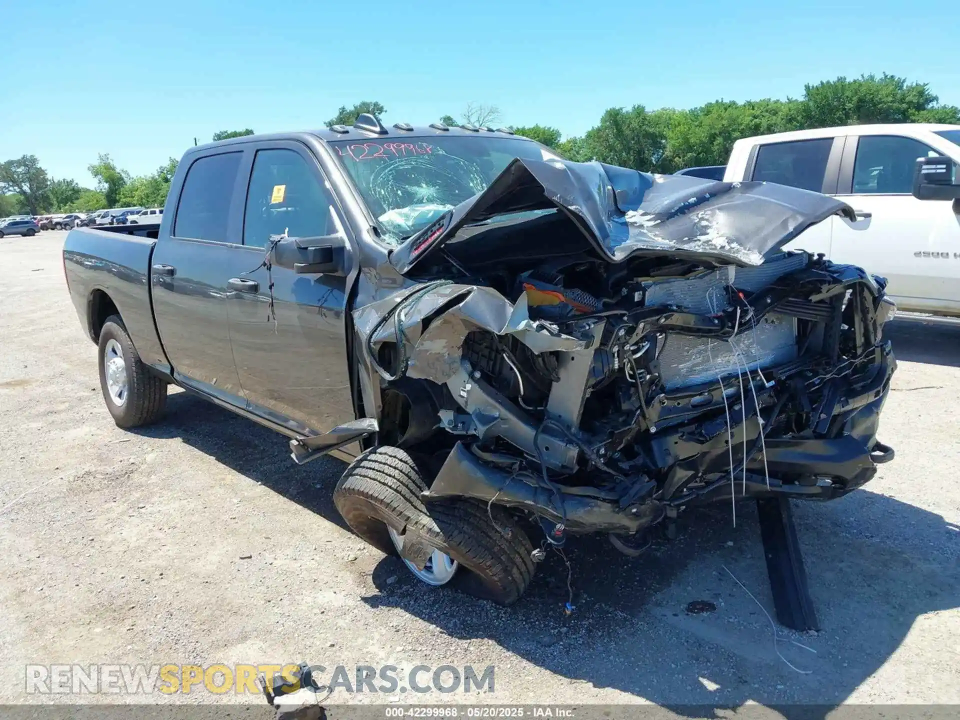1 Photograph of a damaged car 3C6UR5CL9RG330312 RAM 2500 2024