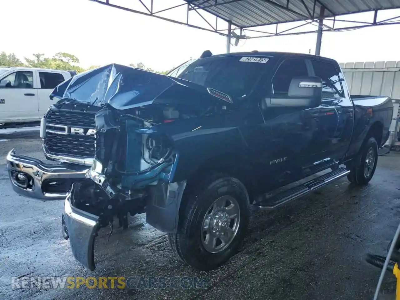 1 Photograph of a damaged car 3C6UR5DJ0RG353426 RAM 2500 2024