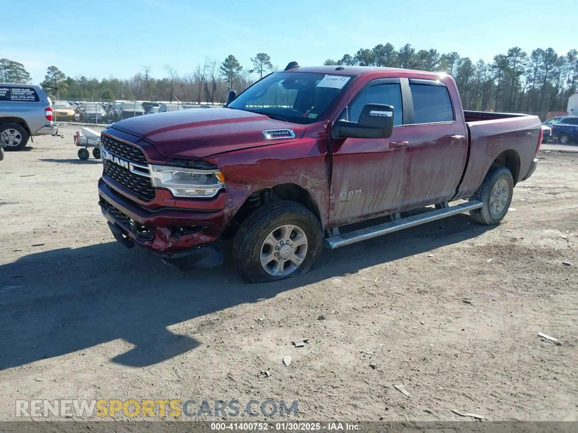 2 Photograph of a damaged car 3C6UR5DJ2RG335705 RAM 2500 2024