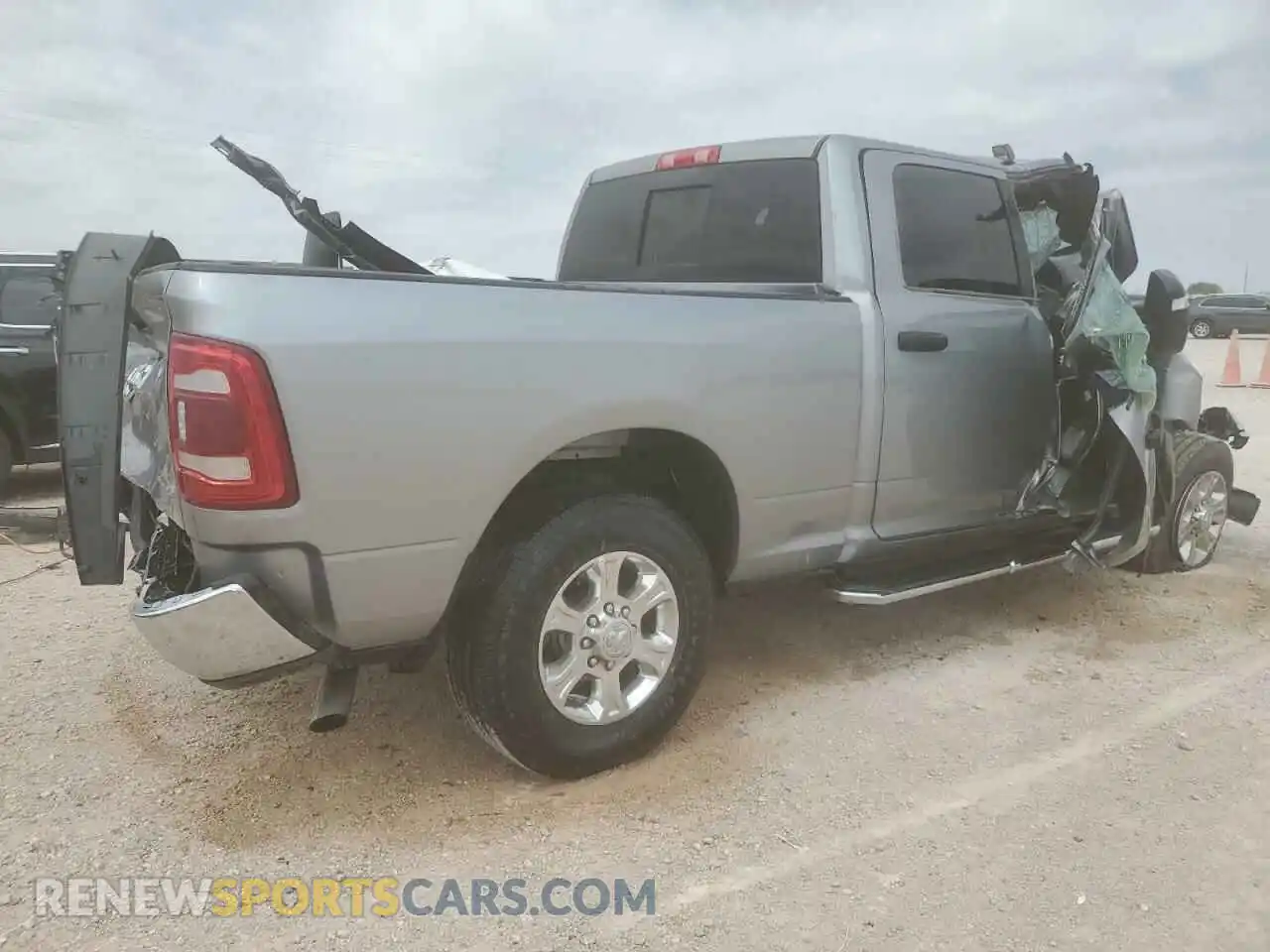 3 Photograph of a damaged car 3C6UR5DJ8RG387050 RAM 2500 2024