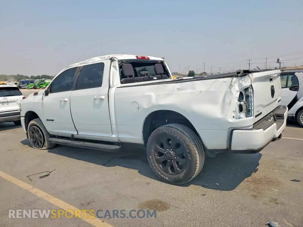 2 Photograph of a damaged car 3C6UR5DJ9RG217389 RAM 2500 2024