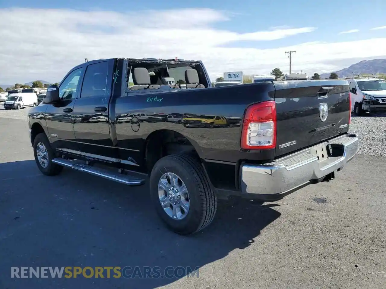 2 Photograph of a damaged car 3C6UR5DJ9RG323356 RAM 2500 2024